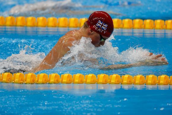  O britânico Adam Peaty leva ouro nos 100m nado peito nos Jogos Olímpicos Rio 2016, no Estádio Aquático. (Foto: Fernando Frazão/Agência Brasil)