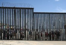 Border Field State Park Beach, CA, USA - July 30, 2023: The USA Mexico Border Wall near Friendship Park and Tijuana Beach Promenade, Mexico.