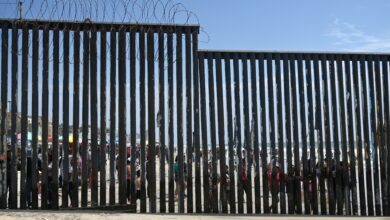 Border Field State Park Beach, CA, USA - July 30, 2023: The USA Mexico Border Wall near Friendship Park and Tijuana Beach Promenade, Mexico.